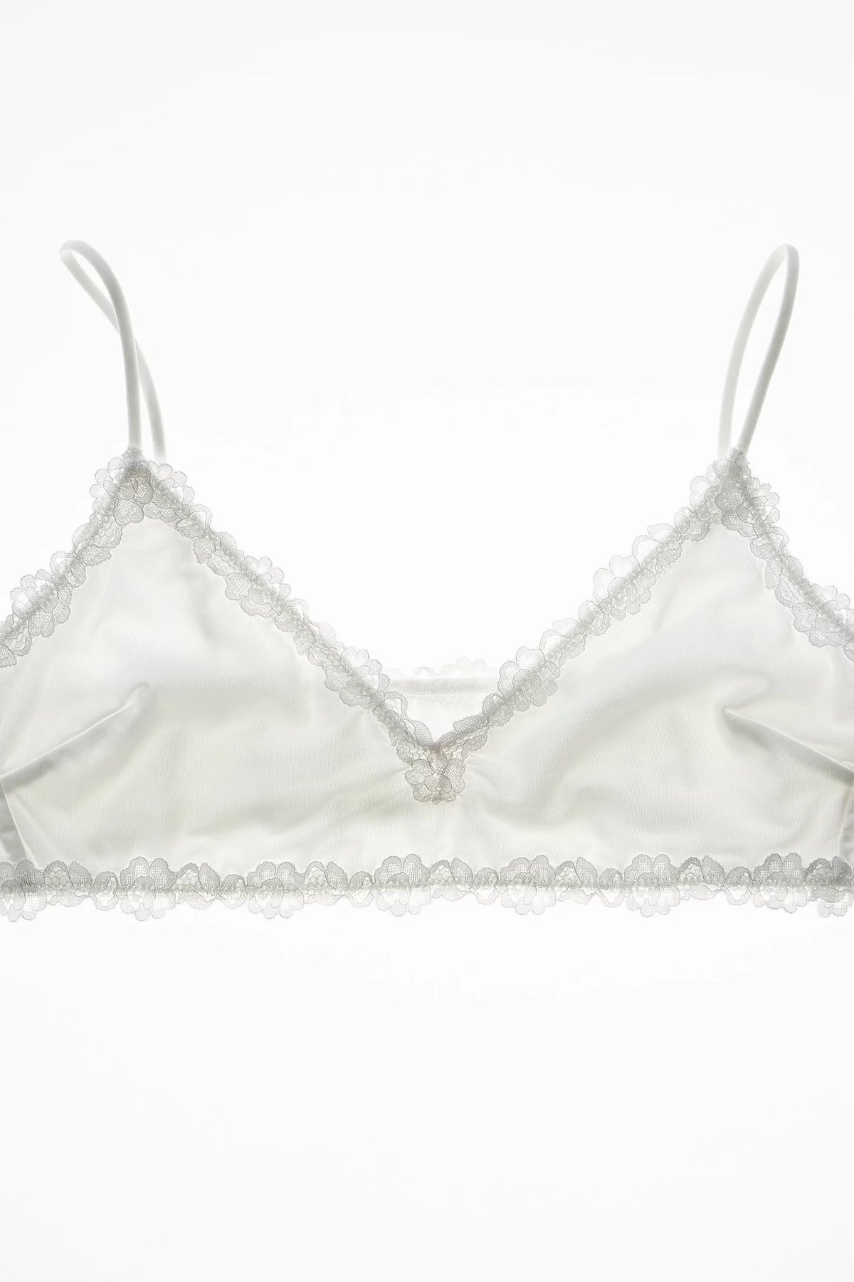 White bralette with lace trim on a white background