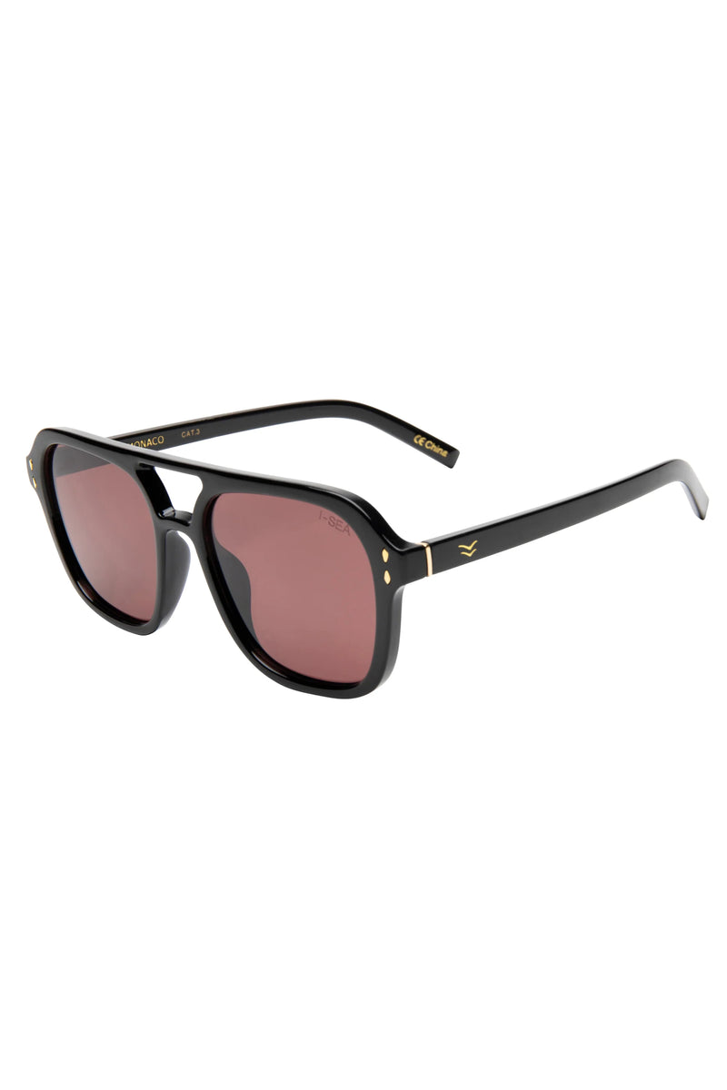 Black sunglasses with pink lenses on a white background