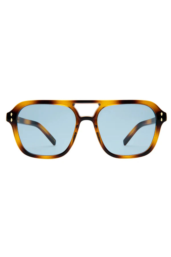 Sunglasses with tortoiseshell frame and blue lenses on a white background