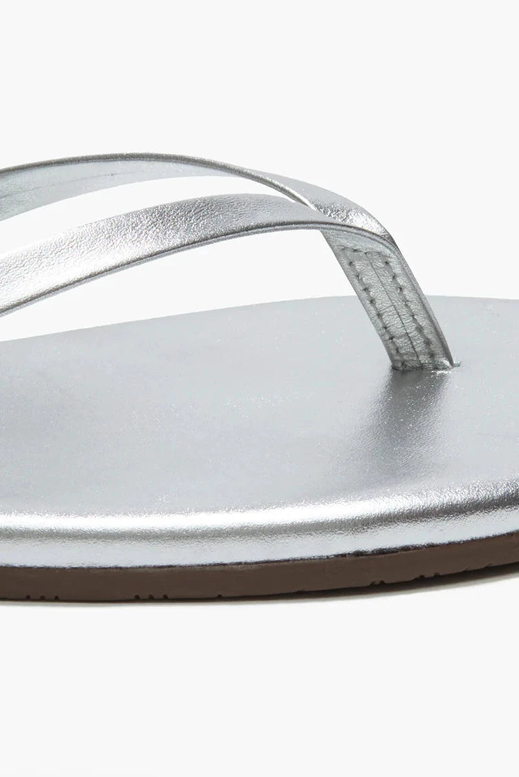 Silver sandal with a strap on a white background