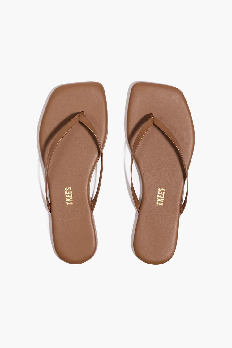 A pair of sandals against a white background
