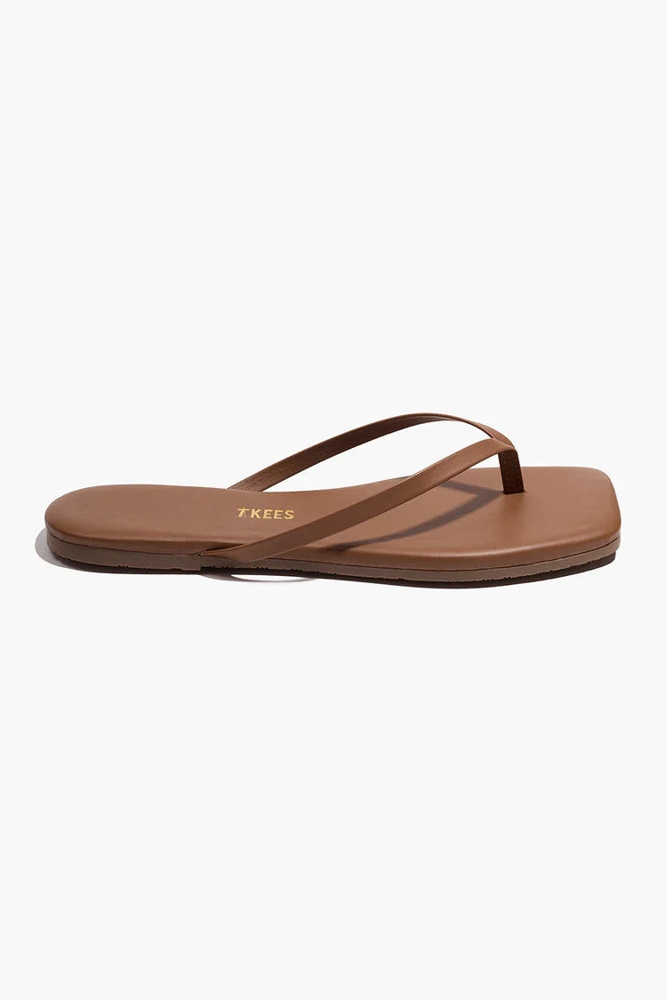 A pair of sandals against a white background